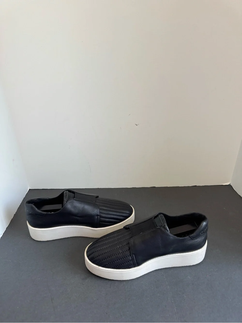 Donna Karan New York black leather slip-on sneakers. Size 6